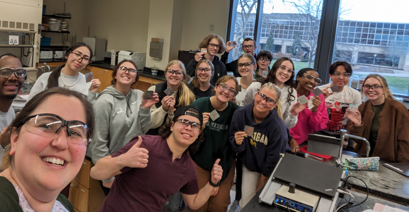 A group of chemistry research students with a faculty member