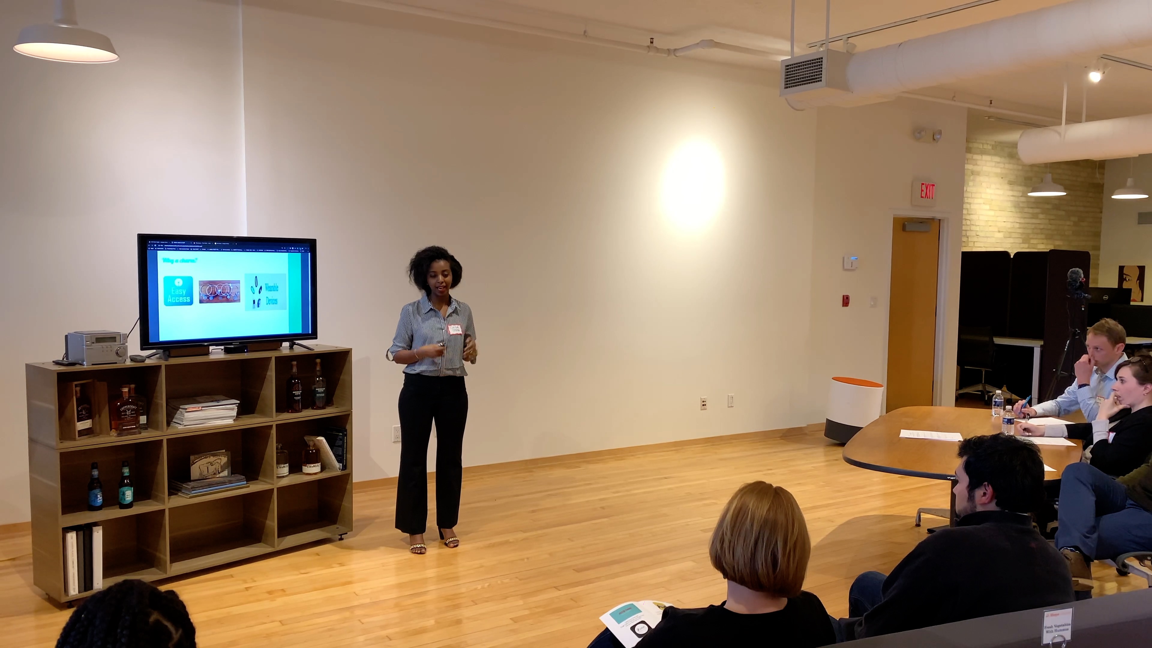 Student pitches presentation to a panel of judges