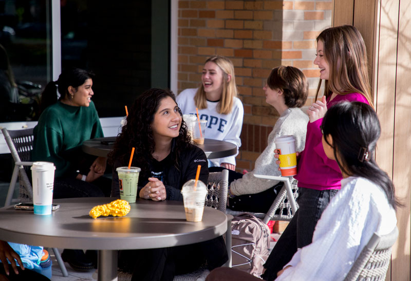 Phelps Scholars enjoying beverages outside Lemonjello's Coffee