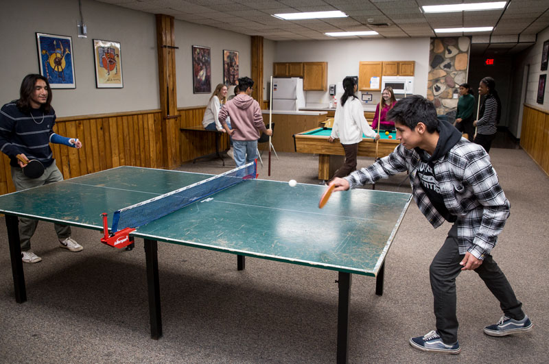 Phelps Scholars playing table tennis in Scott Hall.