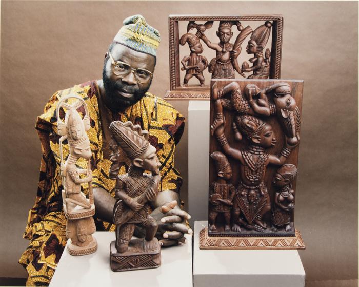 Lamidi Fakeye with his woodcarvings