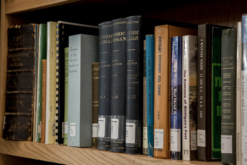 A photo of a dozen books on a shelf