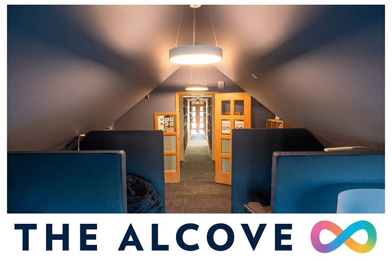 A photo of The Alcove sensory room showing some of the seating in the room and the door to the third floor of the library