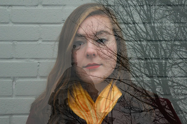 Portrait of a young Caucasian woman overlayed with the image of a tree and the Old Courthouse in Charlotte, Michigan.