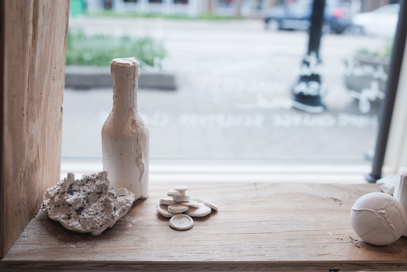 Student sculptures on display in the front window of Frances Jaye, a downtown boutique.