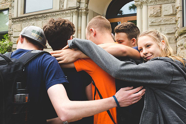 kids hugging in a circle