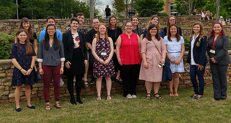 From left to right are: Front Row, Rachel Tishkoff, Annie Dokter, Jenna Savage, Kelly Fuhs, Emily Wolfe, Aine O’Connor, Sarah Lundy, Lucy Cousens, Safia Hattab; Back Row, Michaela Stock, Ben Davison, Jacob Mazur-Batistoni, Cassie Loomis, Annika Gidley, Carolyn Wetzel, Irene Gerrish, Kaitlyn Rustemeyer