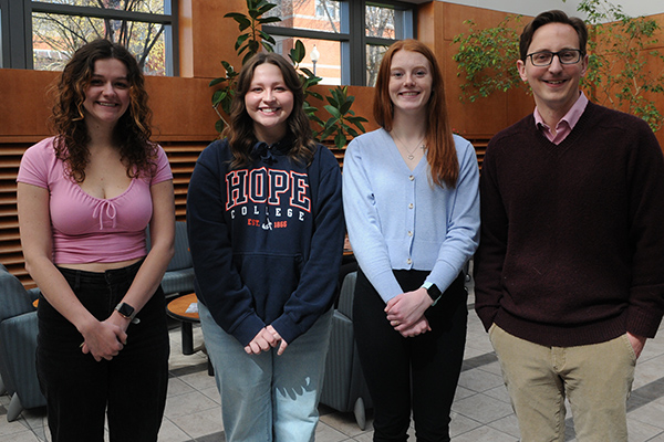 From left to right are psychology student researchers Katherine Yakes, Emma Kane and Brynn Anderson, and faculty mentor and researcher Dr. Benjamin Meagher, assistant professor of psychology.