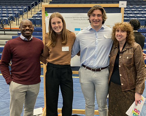 Pictured from left to right are faculty mentor and researcher Dr. Olufemi Oluyedun, assistant professor of kinesiology; psychology student researcher Erin Moran; kinesiology and psychology student researcher Brendyn Mroz; and faculty mentor and researcher Dr. Mary Inman, professor and chair of psychology.