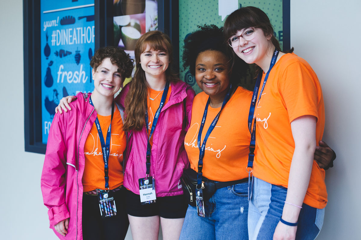 Four female awakening students smiling