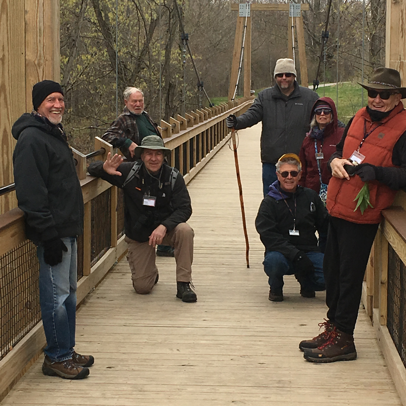 Hiking Small Interest Group smiling on a bridge