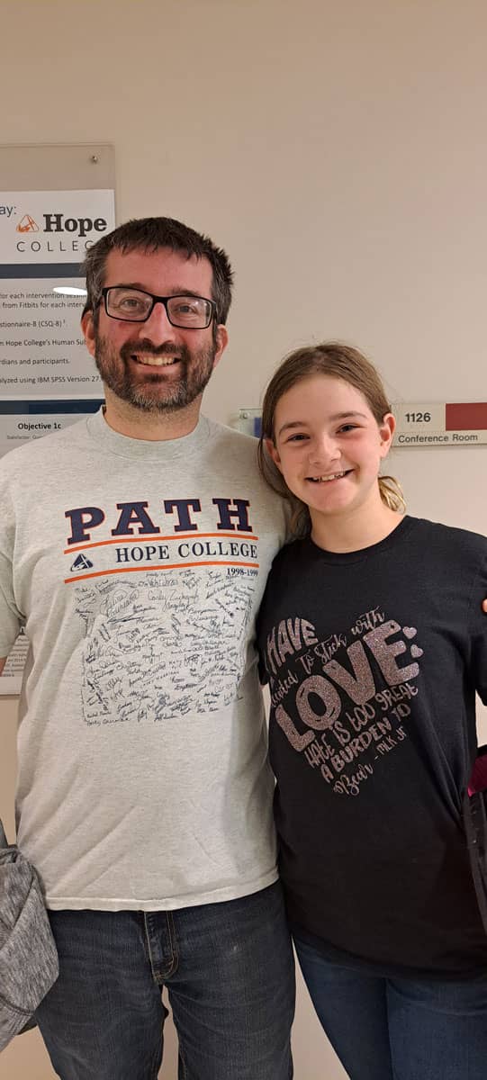 Jake Conway, wearing a PATH shirt, with Addelyn