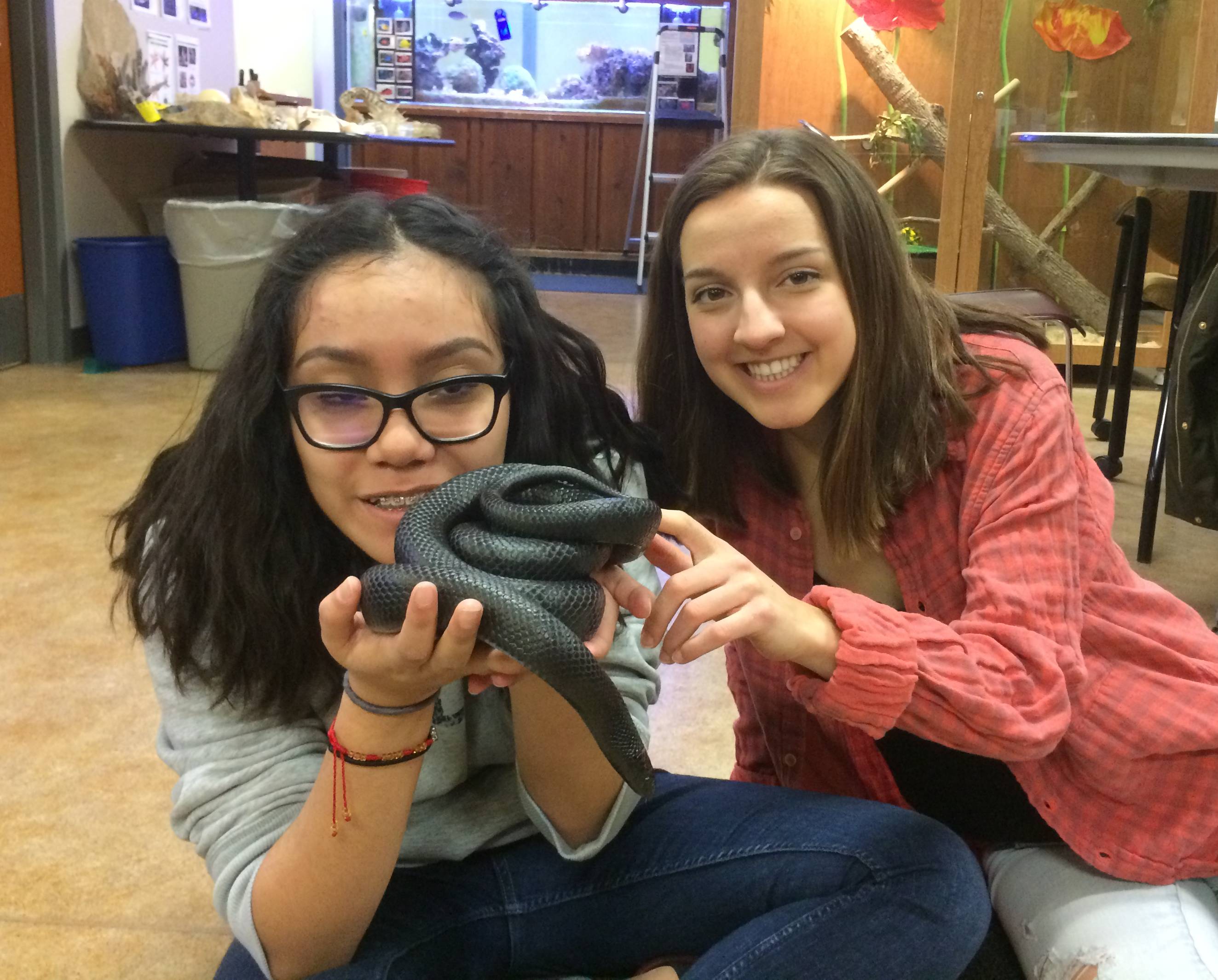 Mentor and student holding snake